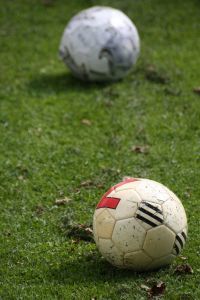 937702_footballs_on_lawn